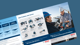 A Bosch Professional tool brochure is held by a man in a hard hat, discussing with another man.