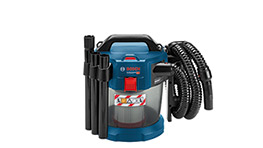 A blue Bosch Professional vacuum cleaner with hoses and attachments is displayed on a white surface.