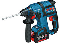 A blue Bosch Professional cordless drill with a metal drill bit attached.